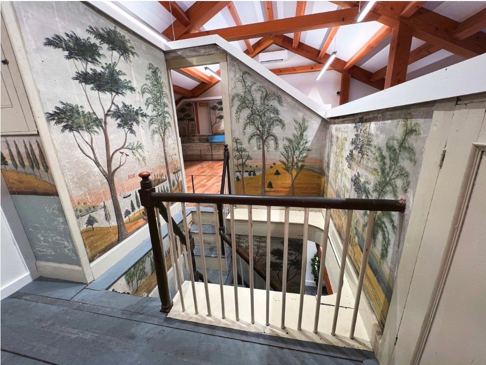 Mural Museum — Jonathan Poor murals at the top of the stair