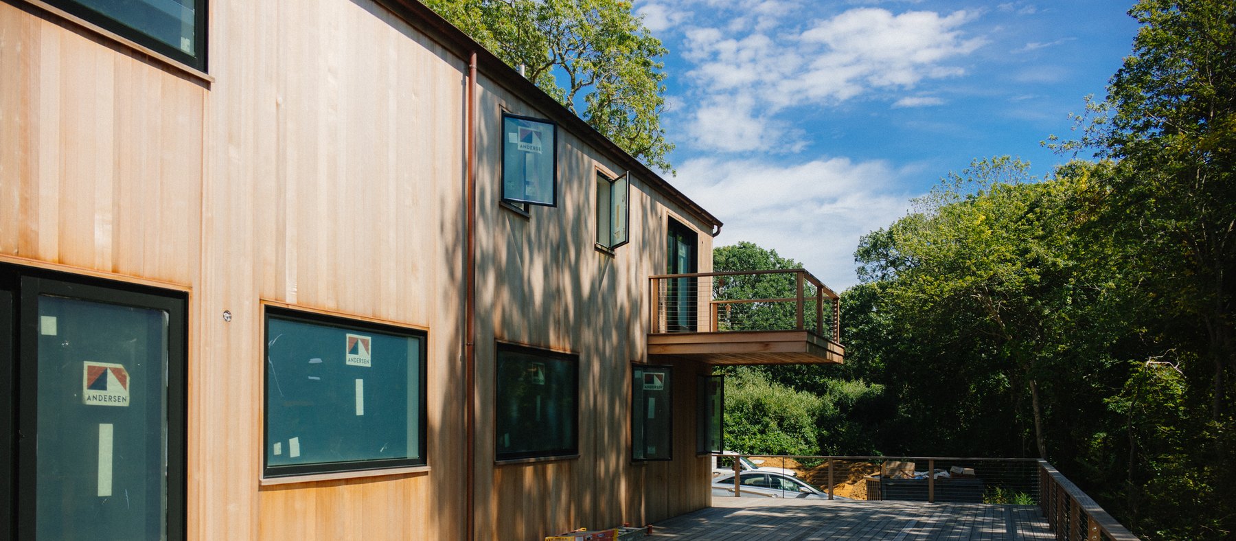 Pennywise Path — the cedar elevation and the cantilevered balcony above the deck